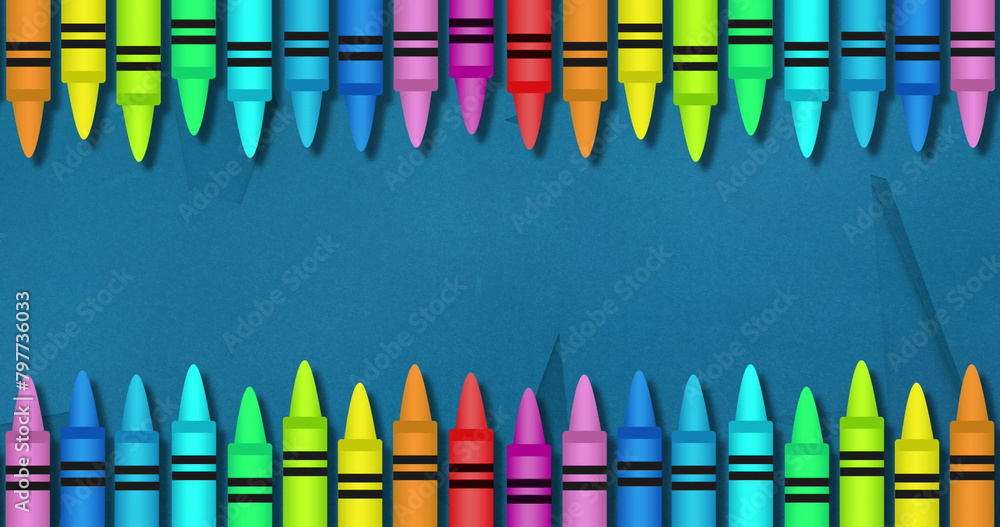 Obraz premium Image of multiple colourful crayons on top and bottom over blue background