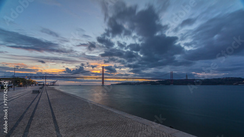 Lisbon city sunrise with April 25 bridge timelapse photo