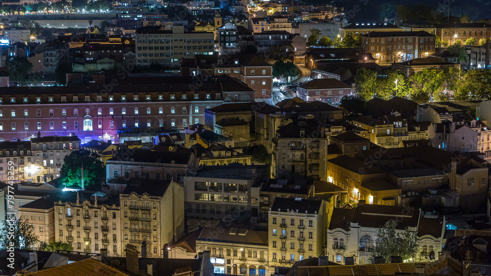Lisbon aerial view of city centre with illuminated building at night timelapse, Portugal