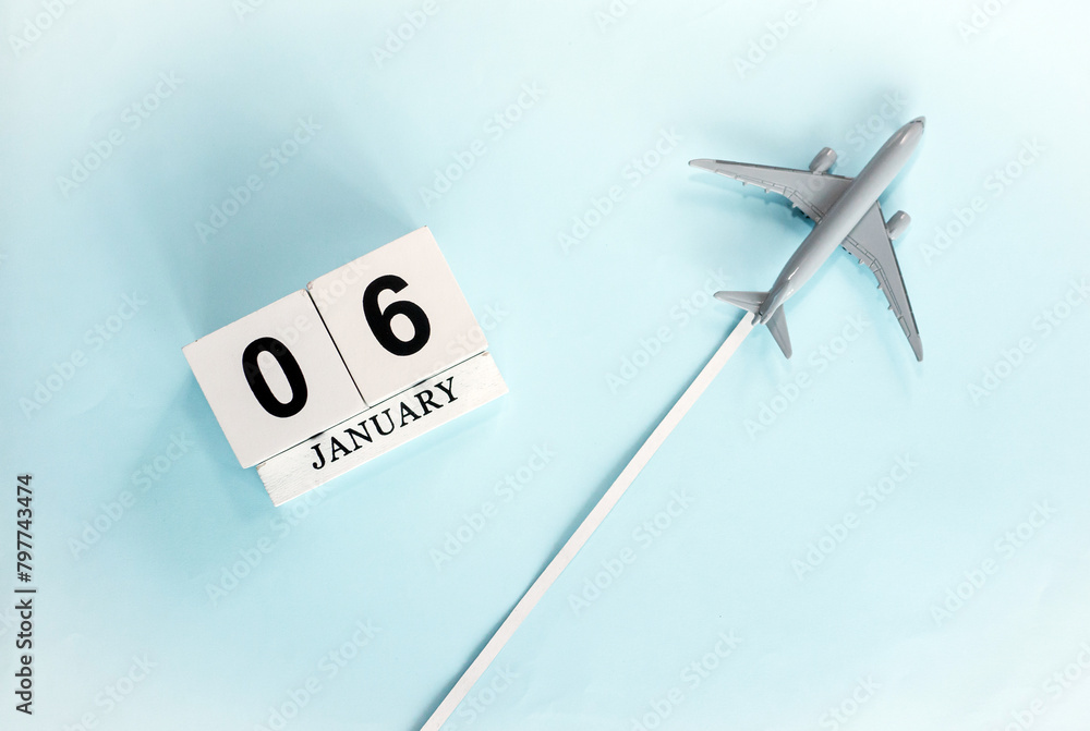 January calendar with number 6. Top view of a calendar with a flying passenger plane. Planner for the year by date of the day. Copy space. January calendar with number 6. Top view of a calendar with a flying passenger plane. Planner for the year by date of the day. Copy space.
