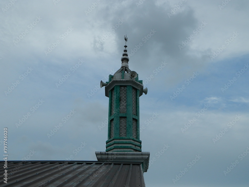 Photo of the mosque tower taken from the top floor of a multi-storey building. The mosque tower is used as a marker and also as a loudspeaker