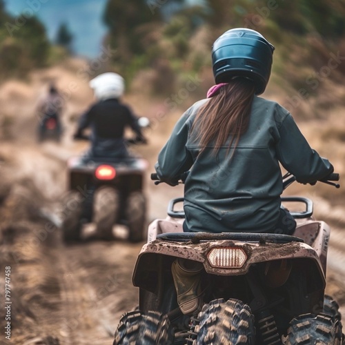 Woman on ATV riding dirt road on Land vehicle with Helmet