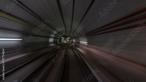 Fototapeta Naklejka Na Ścianę i Meble -  Moving in the subway tunnel with light trails inside timelapse