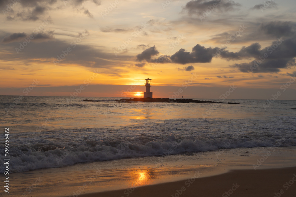 Fototapeta premium Lighthouse tower, Khao Lak with seawater, Andaman sea in Phang Nga Bay island in summer season, Thailand. Tourist attraction.