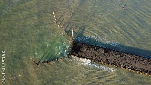 Drone footage of a fishing pier on a sunny day in Shoreham-by-Sea town, West Sussex, England photo