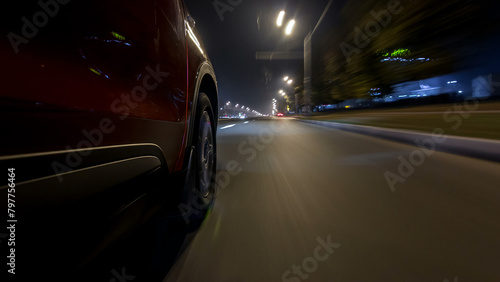 Drivelapse urban look from fast driving car at a night avenue in a city timelapse hyperlapse © neiezhmakov