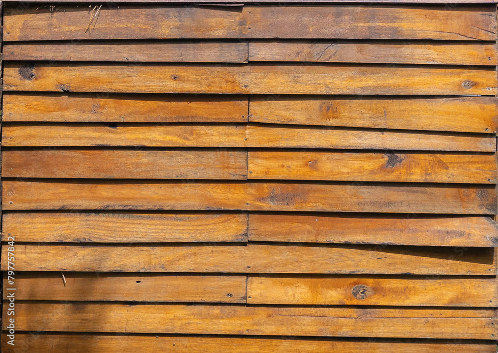 Fototapeta premium Natural wood slats wall or lath line arrange. Flooring pattern surface texture. Close-up of interior architecture material for design decoration background.