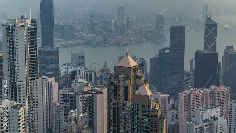 Obraz premium View of Hong Kong from Victoria peak in a foggy morning timelapse.