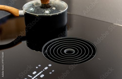 Tablou pe pânză Close-up photo of venting induction hob with built-in central extractor