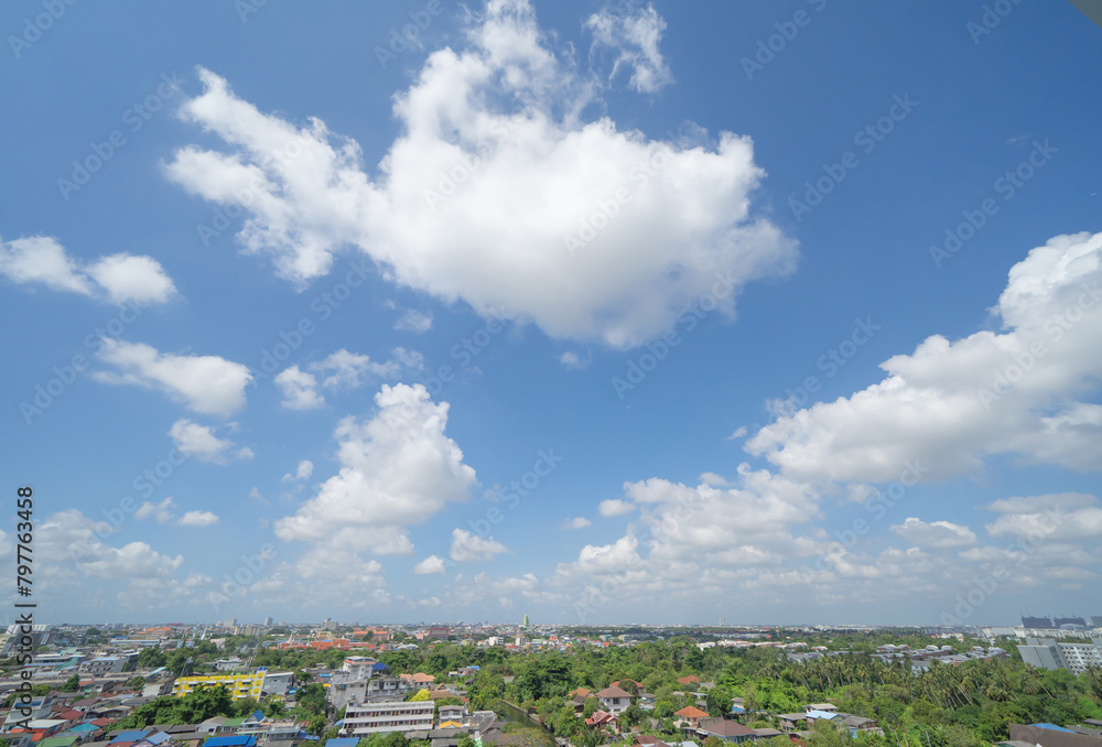 Fototapeta premium Clear blue sky with white fluffy clouds at noon. Day time. Abstract nature landscape background.