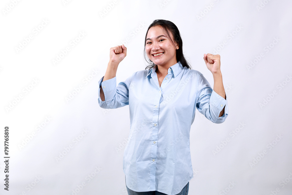 Enthusiastic asian woman rejoicing, feels happy and celebrating victory, champion dance, fist pump gesture, standing over white background Enthusiastic asian woman rejoicing, feels happy and celebrating victory, champion dance, fist pump gesture, standing over white background