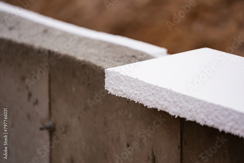 Close-up of a concrete wall with polyfoams at an industrial construction site