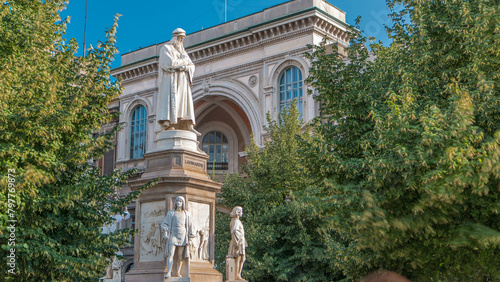 Monument to Leonardo da Vinci in Piazza della Scala meaning La Scala square timelapse in Milan, Italy photo