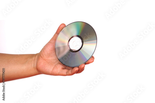 Close up hand hold CD compact disc, DVD, isolated on white background. Concept, tool, equipment for setup or install programs in computer or music, movie for dvd player.           