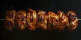 Delicious chicken wings on a skewer, a popular appetizer choice