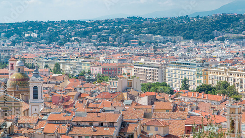 Bright sun lights red roofs of the old city timelapse. Aerial view from Shatto's hill. Nice, France photo