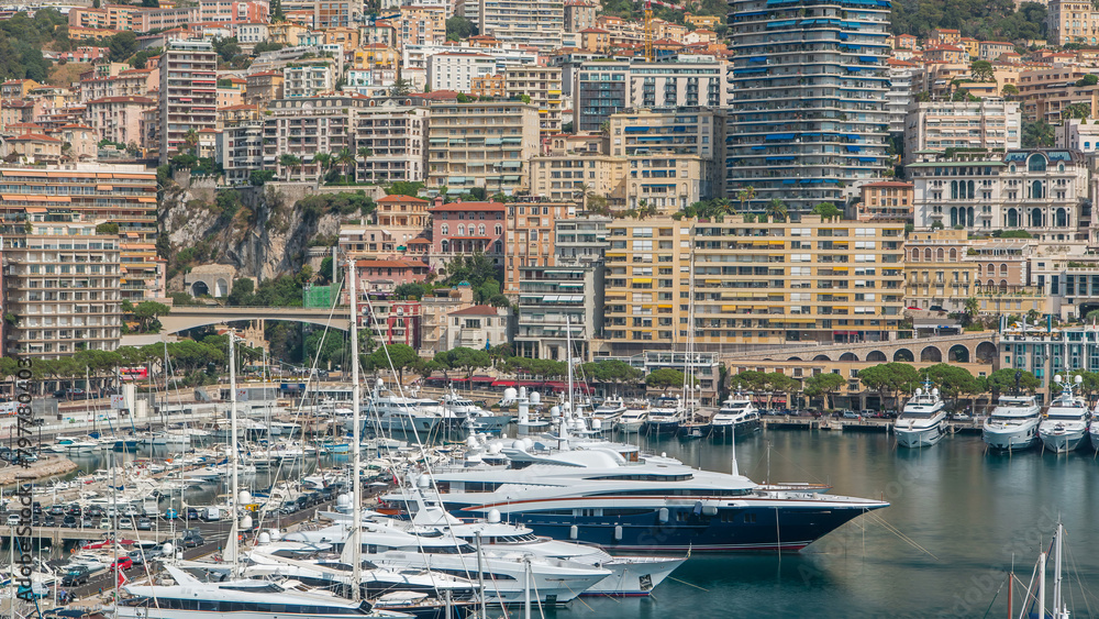 Monte Carlo city aerial panorama timelapse. View of luxury yachts and apartments in harbor of Monaco, Cote d'Azur.
