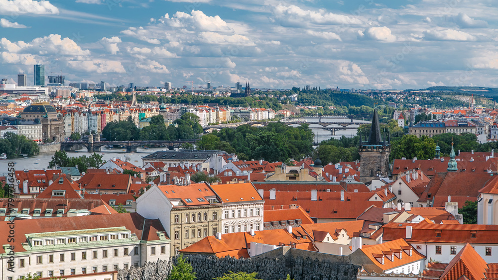 Panorama of Prague Old Town with red roofs timelapse, famous bridges and Vltava river, Czech Republic.