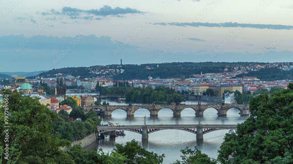 Scenic view of bridges on the Vltava river day to night timelapse and of the historical center of Prague: buildings