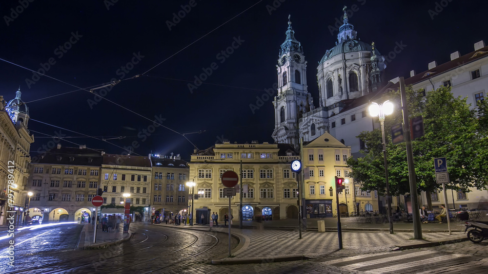 Obraz premium Night view of the illuminated malostranske namesti square timelapse hyperlapse in prague
