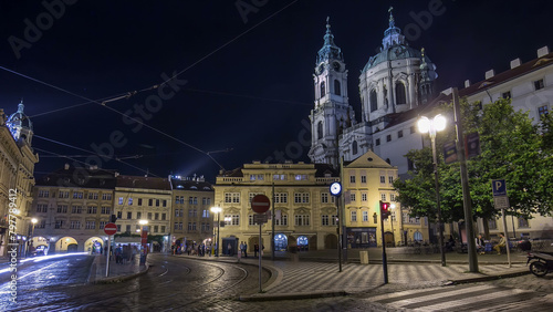 Night view of the illuminated malostranske namesti square timelapse hyperlapse in prague photo