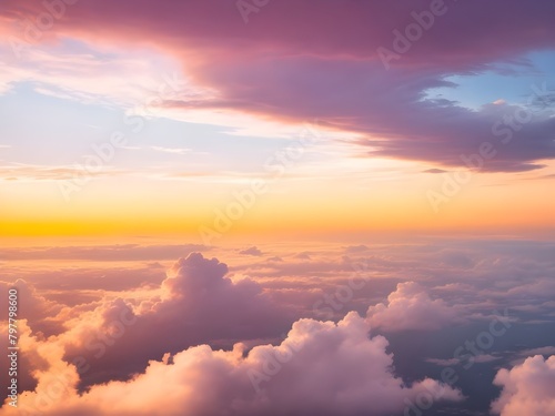 Dramatic amazing sky and clouds from above at sunset. Colorful pastel sky