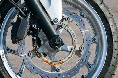 ventilated brake disc of the front wheel of a sports motorcycle. rust photo