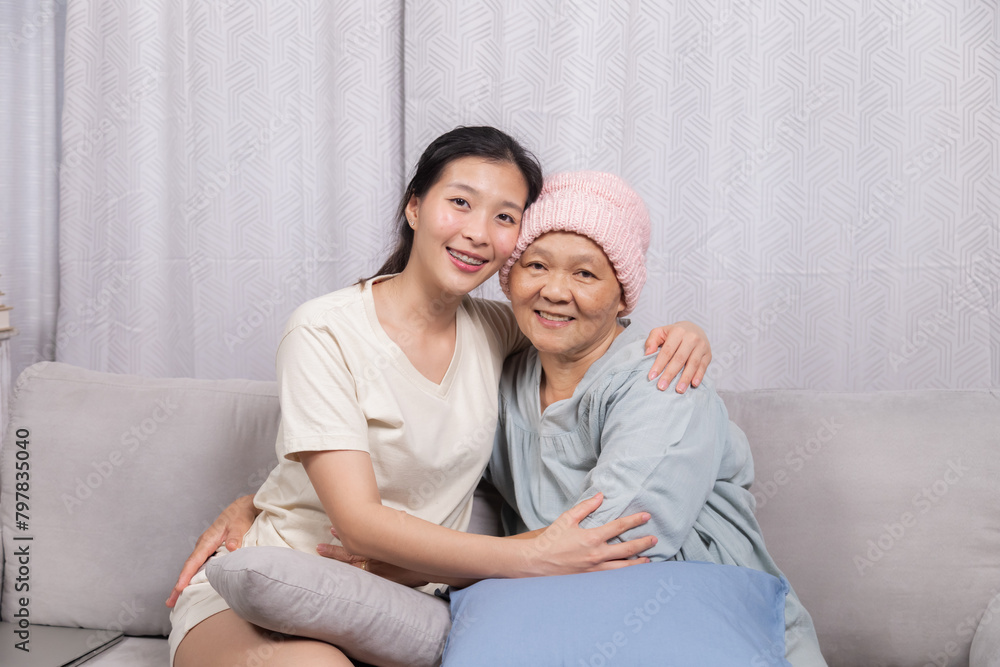 Senior woman breast cancer sickness embraces daughter spends joyful time sitting together bonding relationship after chemotherapy recovered, elderly retirement female happy with good news from doctor Senior woman breast cancer sickness embraces daughter spends joyful time sitting together bonding relationship after chemotherapy recovered, elderly retirement female happy with good news from doctor