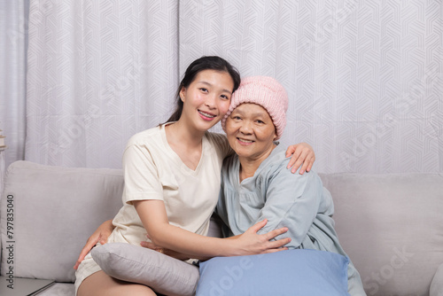 Senior woman breast cancer sickness embraces daughter spends joyful time sitting together bonding relationship after chemotherapy recovered, elderly retirement female happy with good news from doctor