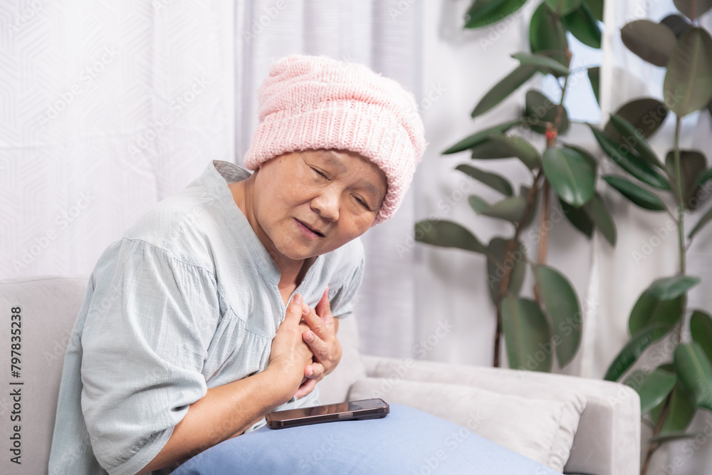 Stressed senior woman with breast cancer have trouble with chemotherapy healing, elderly retirement female pain and difficulty breathing according to chemotherapy or heart attacks stay at home alone Stressed senior woman with breast cancer have trouble with chemotherapy healing, elderly retirement female pain and difficulty breathing according to chemotherapy or heart attacks stay at home alone