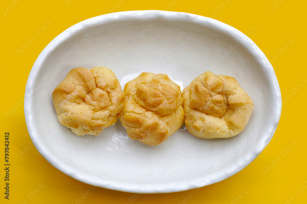 Cream puffs in white bowl
