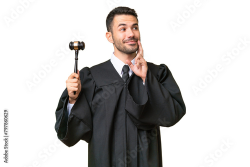 Judge caucasian man over isolated background thinking an idea while looking up