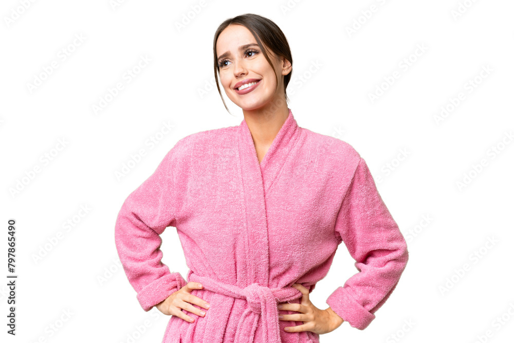 Young beautiful woman in a bathrobe over isolated chroma key background posing with arms at hip and smiling Young beautiful woman in a bathrobe over isolated chroma key background posing with arms at hip and smiling