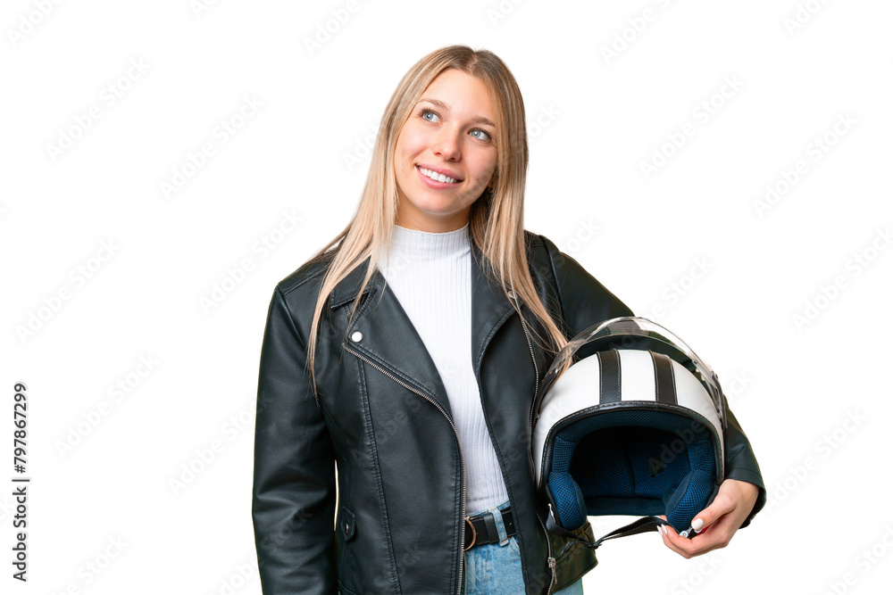 Young pretty blonde woman with a motorcycle helmet over isolated chroma key background thinking an idea while looking up Young pretty blonde woman with a motorcycle helmet over isolated chroma key background thinking an idea while looking up