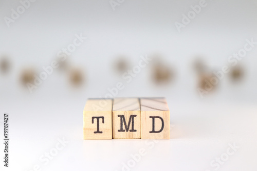 TMD acronym. Concept ofTemporomandibular disorder on white background. photo