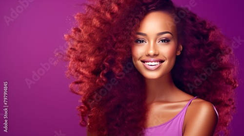 Beautiful  sexy  happy smiling dark-skinned African American woman with perfect skin and red hair  on a purple background  banner.
