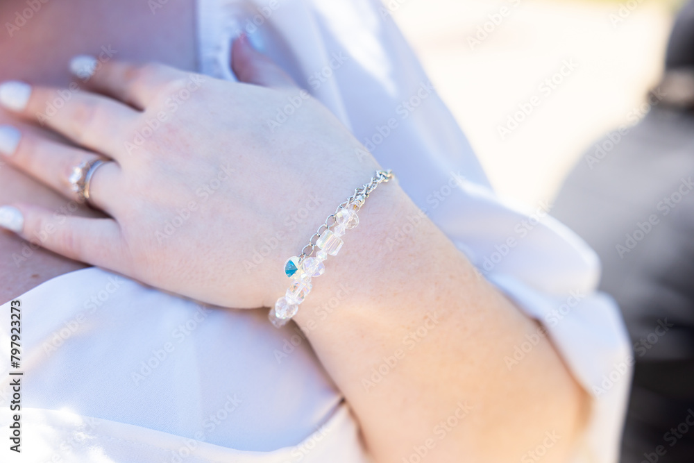 Fototapeta premium Bracelet on a brides wrist from a recent wedding