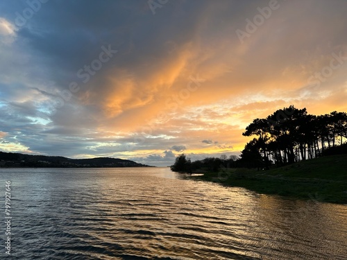 Sunset over the river Minho with trees on the shore, Eiras, O Rosal, Galicia, Spain, February 2023 photo