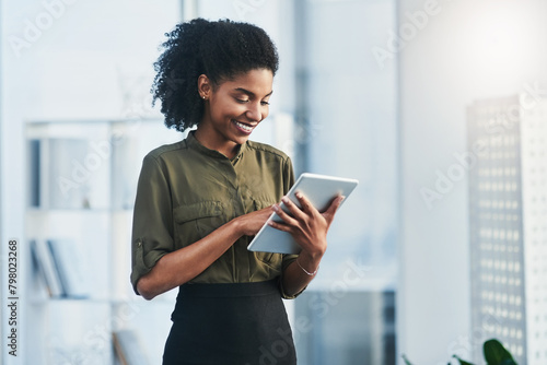 Tablet, business and black woman in office online for social media, online report and planning. Happy, corporate worker and person on digital technology for project ideas, website and research © peopleimages.com