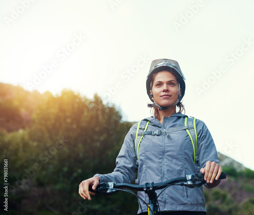 Morning, woman and mountain bike in outdoors, fitness and cycling sports for cardio adventure. Female person, athlete and bicycle for exercise in nature, workout and training on sky mockup space