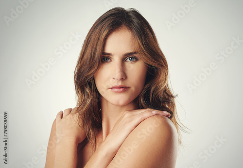 Hug, self love and portrait of woman for skincare, beauty and dermatology with confidence isolated on gray background. Hand, skin and model natural with glow, wellness and soft on studio backdrop