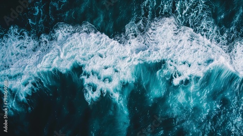 Aerial perspective background photo featuring the intense interaction of white waves with the deep sea, offering a spectacular visual experience