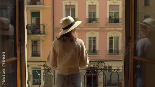 Woman Standing on Balcony Overlooking European Architecture (ID: 798066248)