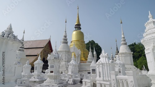 Dolly shot of golden pagoda at Suandok temple Chiangmai thailand steady cam 