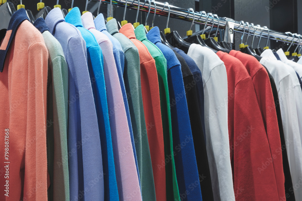 Fototapeta premium A rack of clothes with a variety of colors and patterns