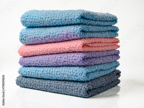 Stack of Colorful Textured Towels. isolated on a white background