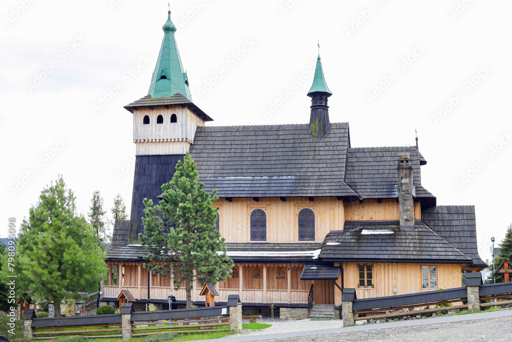 WITOW, POLAND - APRIL 19, 2024: .Historic wooden church and its surroundings in Witow, Poland.