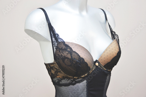 Lace black combodress bra, grace, body corset on a mannequin in a store. Lingerie. photo