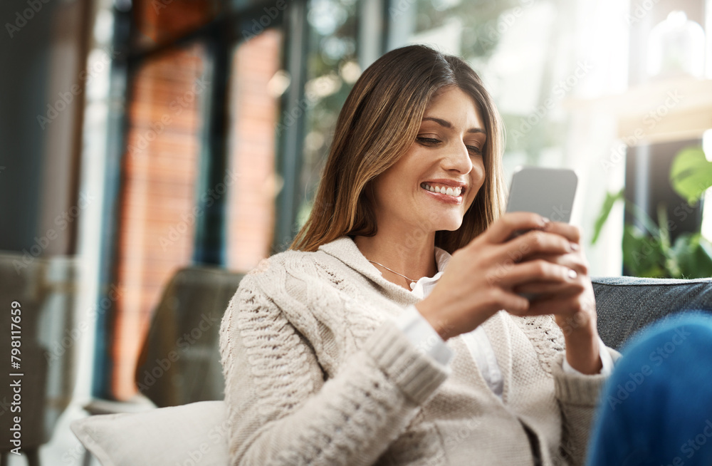 Happy woman, relax and chatting with phone for social media, communication or browsing at home. Female person with smile on mobile smartphone for online texting, app or scrolling on living room sofa Happy woman, relax and chatting with phone for social media, communication or browsing at home. Female person with smile on mobile smartphone for online texting, app or scrolling on living room sofa