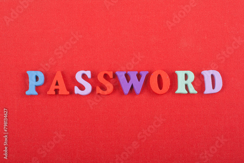 PASSWORD word on red background composed from colorful abc alphabet block wooden letters, copy space for ad text. Learning english concept.